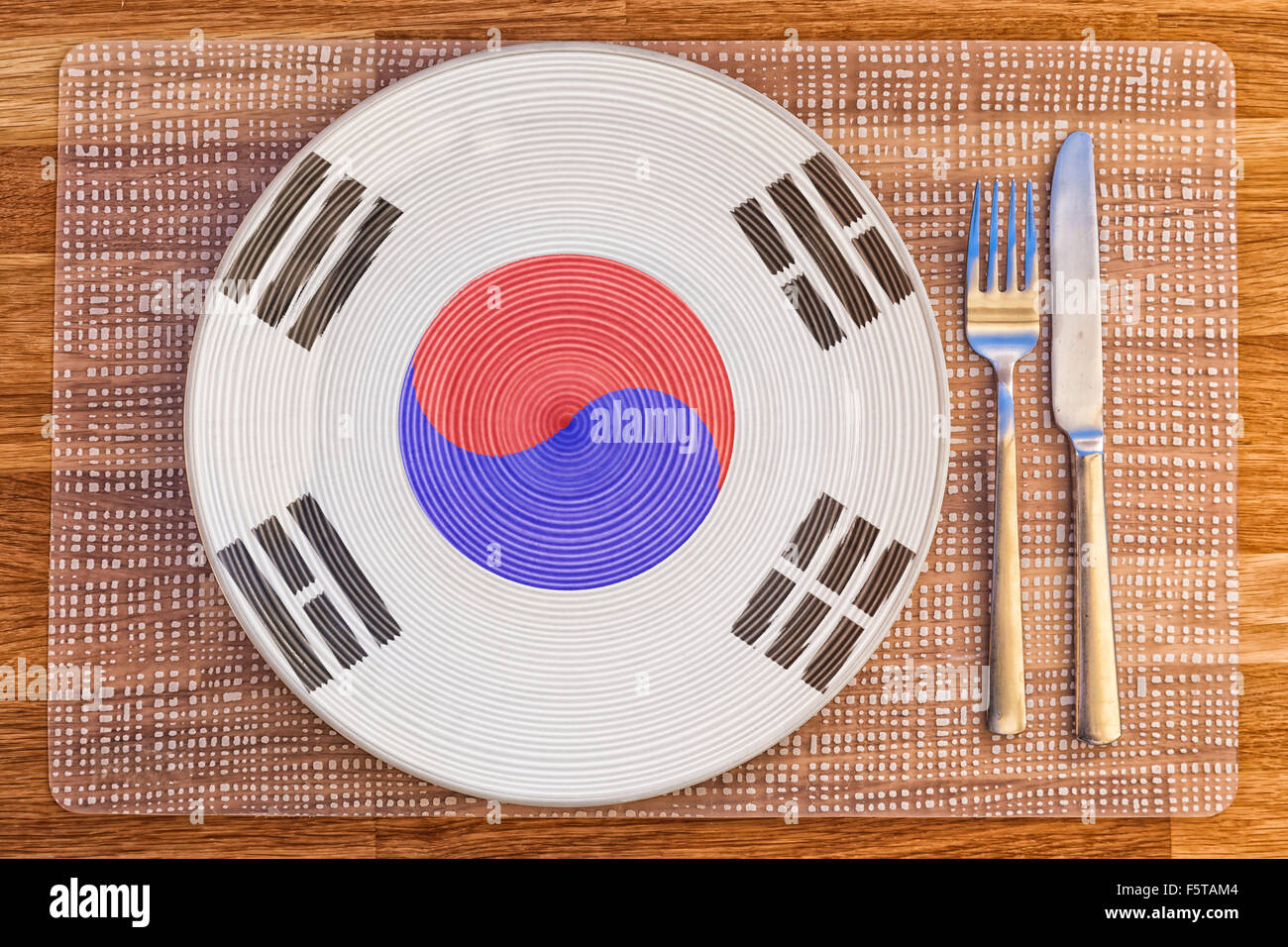 Dinner plate with the flag of South Korea on it for your international food and drink concepts. Stock Photo