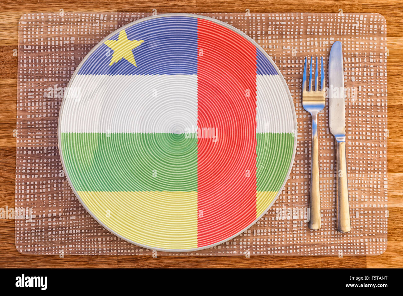 Dinner plate with the flag of the Central African Republic on it for your international food and drink concepts. Stock Photo