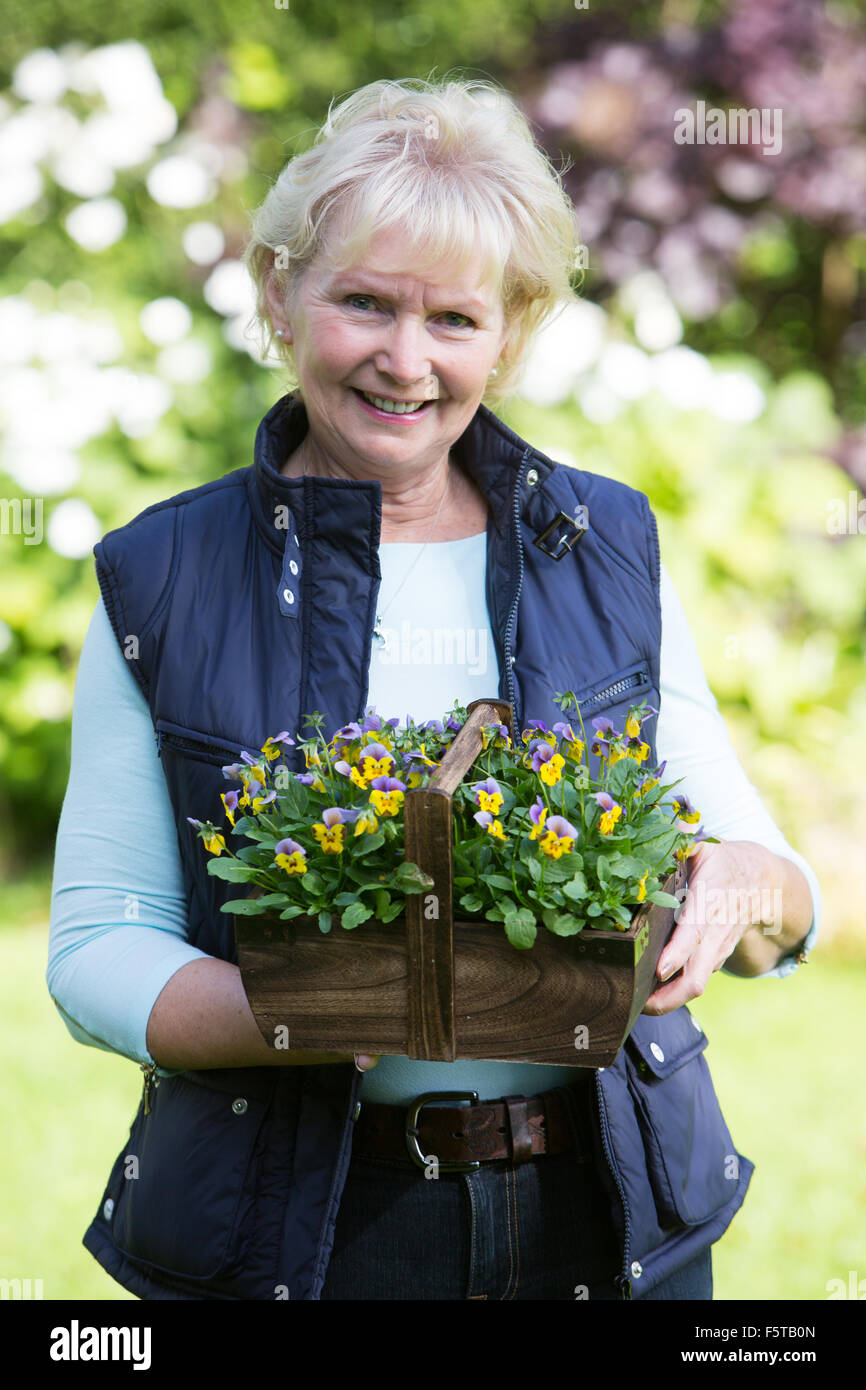 Portrait Of Senior Woman Working In Garden Stock Photo - Alamy