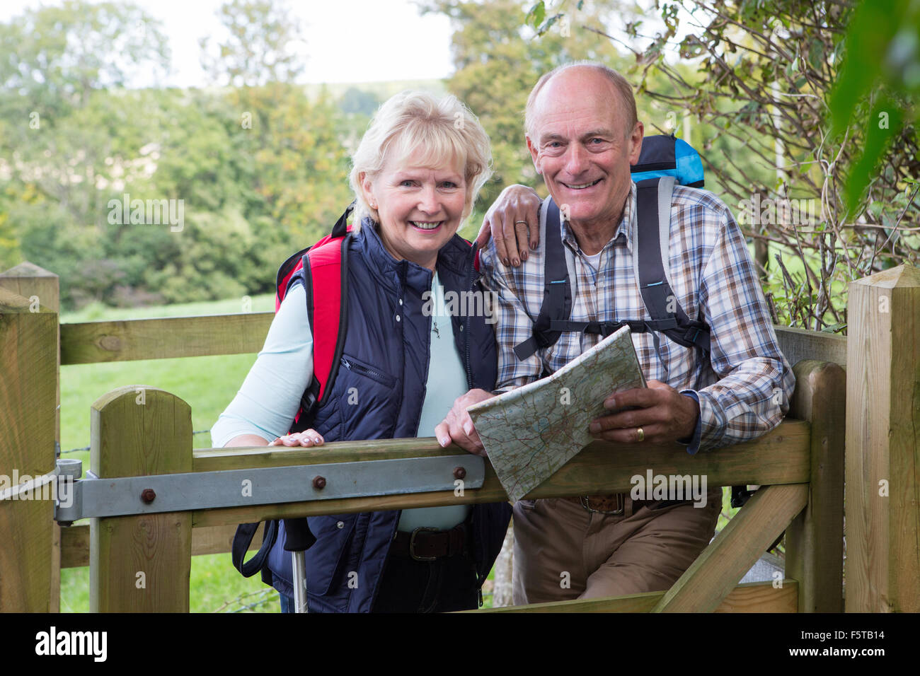 Active Senior Couple On Walk In Countryside Stock Photo