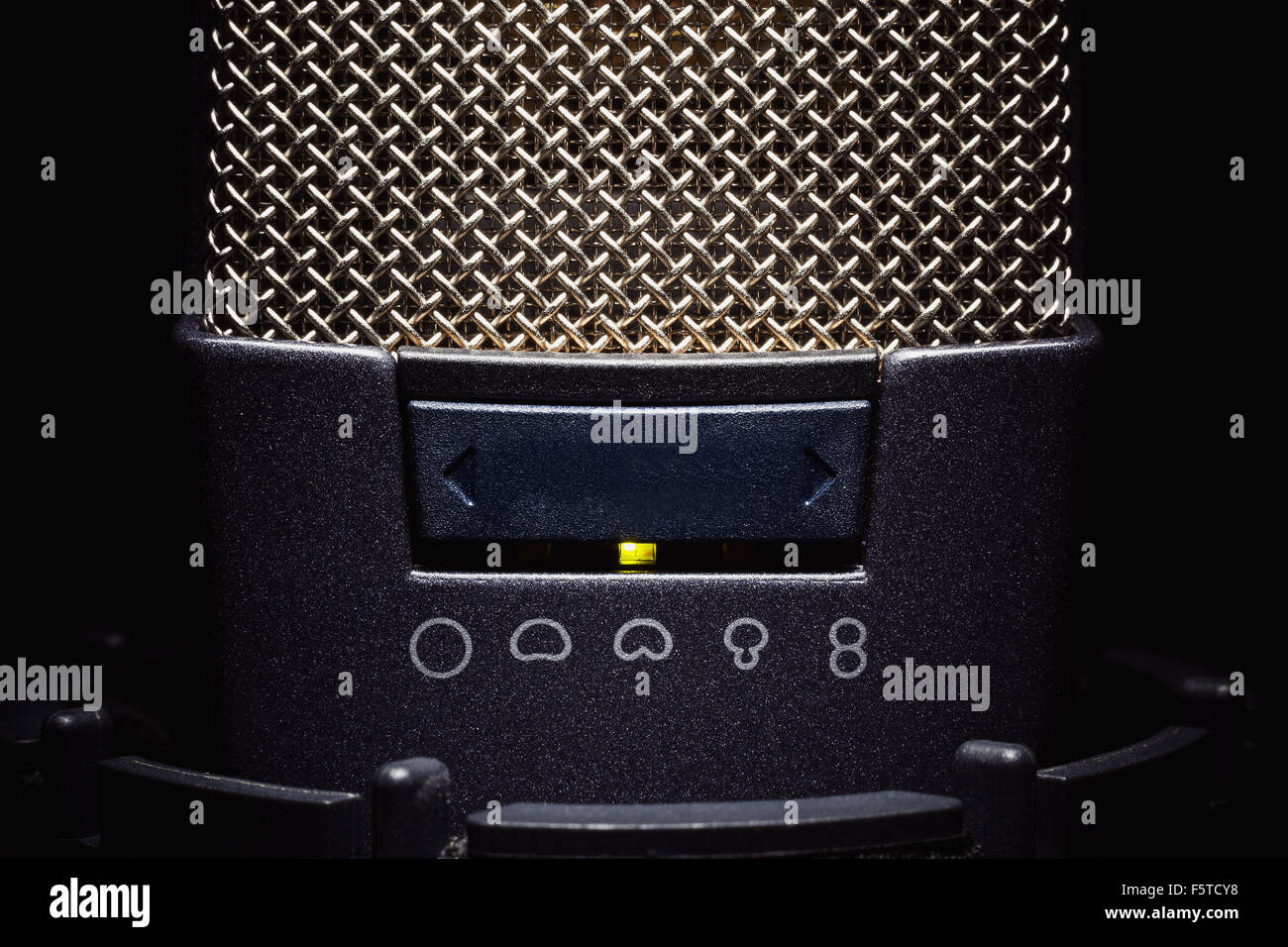 Head details of a microphone, switchers for various frequencies and volume. Stock Photo