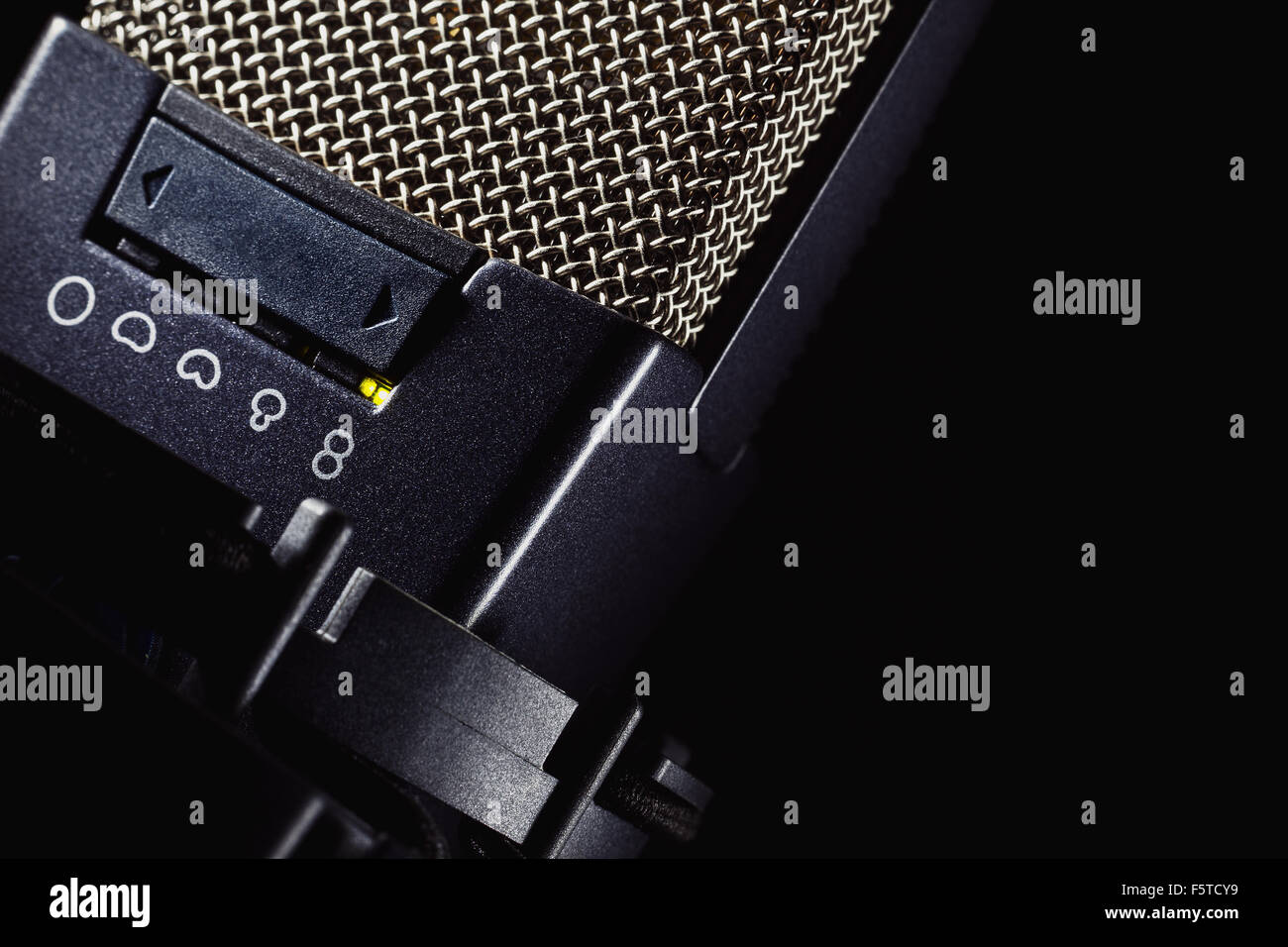 Head details of a microphone, switchers for various frequencies and volume. Stock Photo