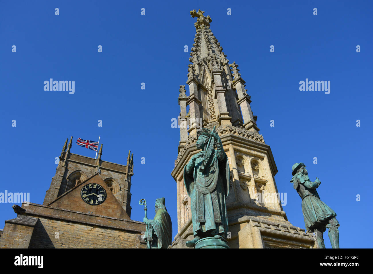 Union Jack flag at half mast on Sherborne Abbey, on the 75th Anniversary of the Bombing of Sherborne, 30th  Sept 2015. Stock Photo