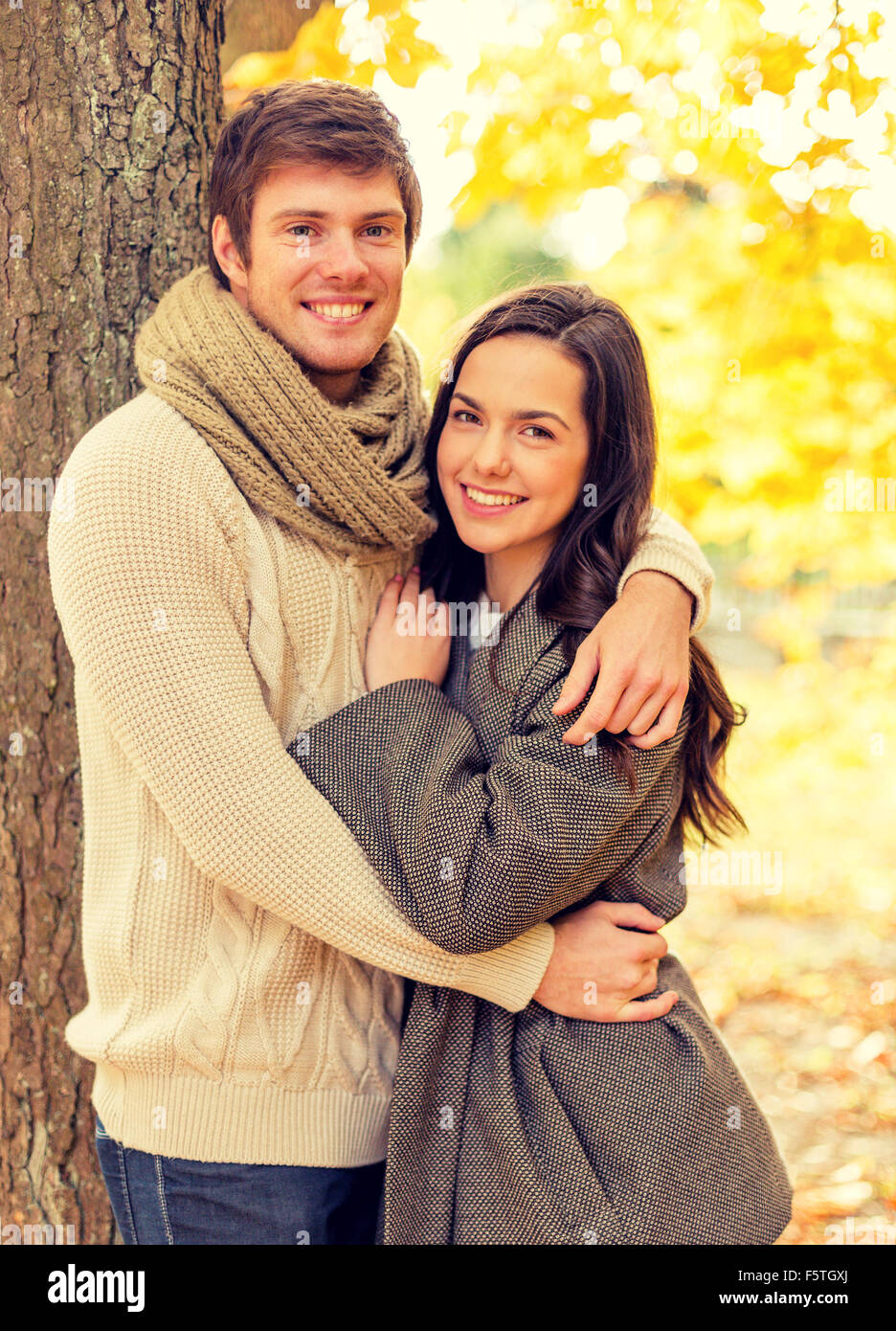 smiling couple hugging in autumn park Stock Photo - Alamy