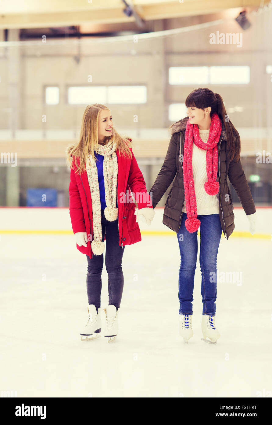 Two teen girl friends goofing off on an outdoor ice rink in Southern  California Stock Photo - Alamy