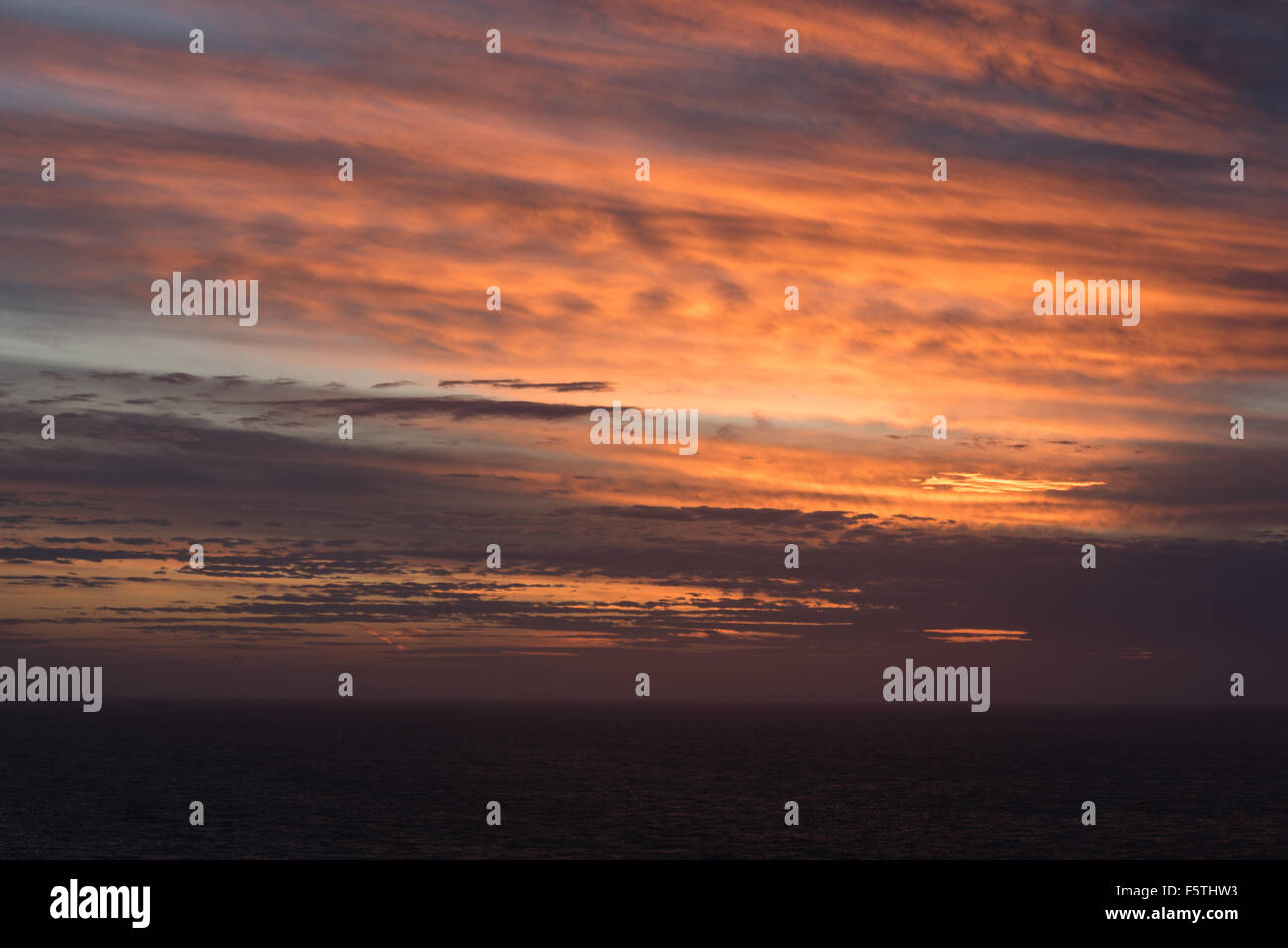 A beautiful colorful sunset over the ocean Stock Photo - Alamy