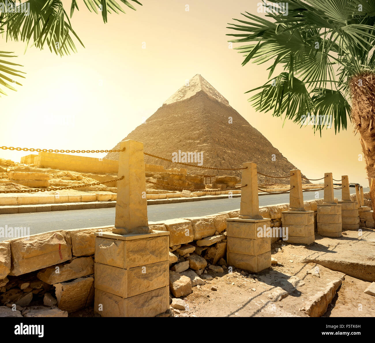 Pyramid of Khafre and asphalted road with columns Stock Photo