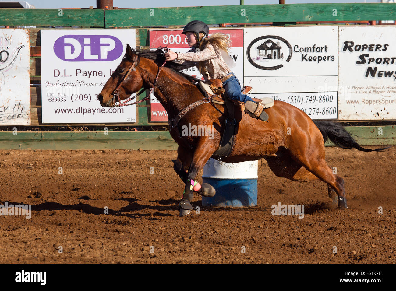 Young women compete in barrel racing at the Lincoln, California Rodeo