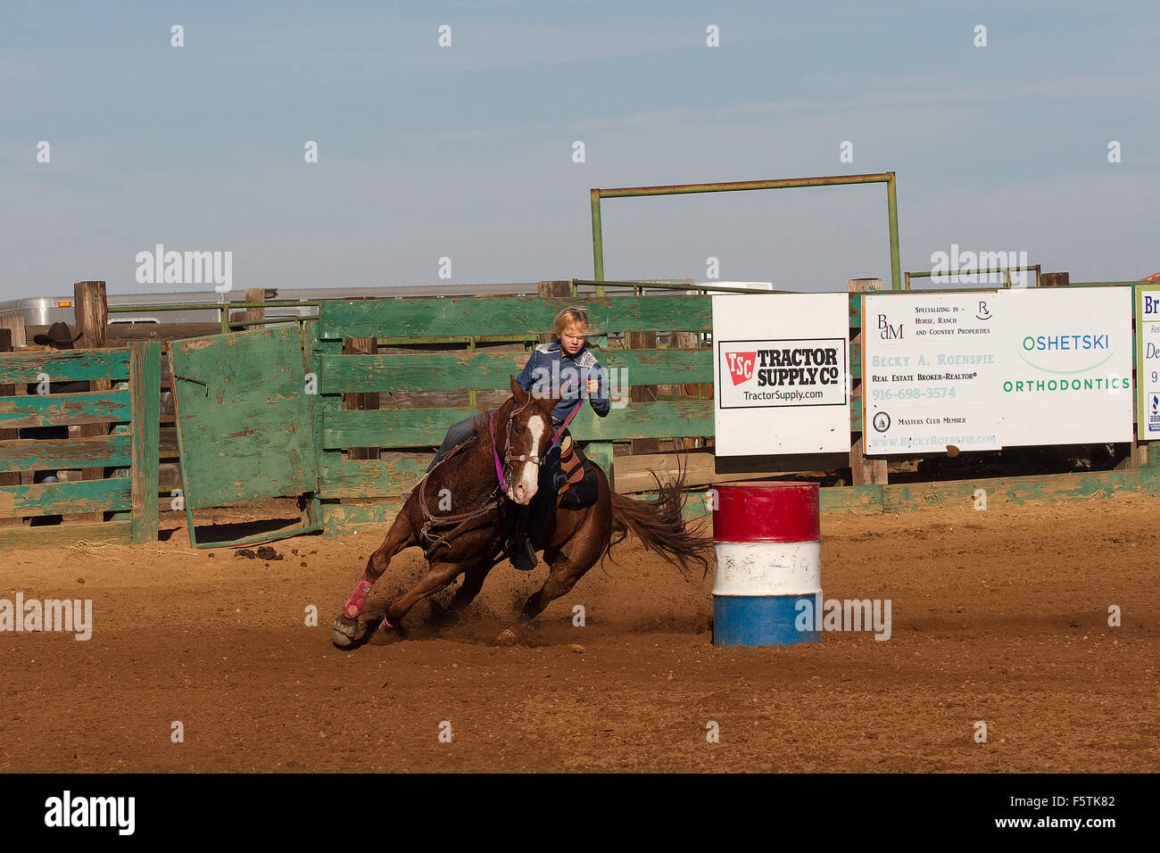 Young women compete in barrel racing at the Lincoln, California Rodeo
