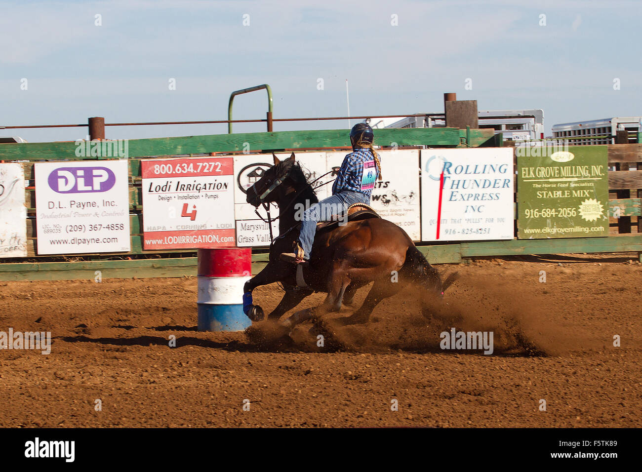 Young women compete in barrel racing at the Lincoln, California Rodeo