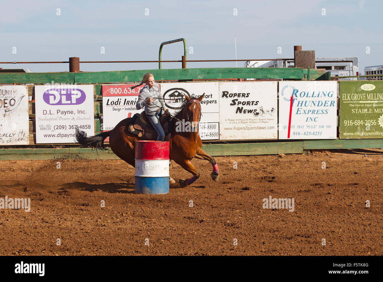 Young women compete in barrel racing at the Lincoln, California Rodeo