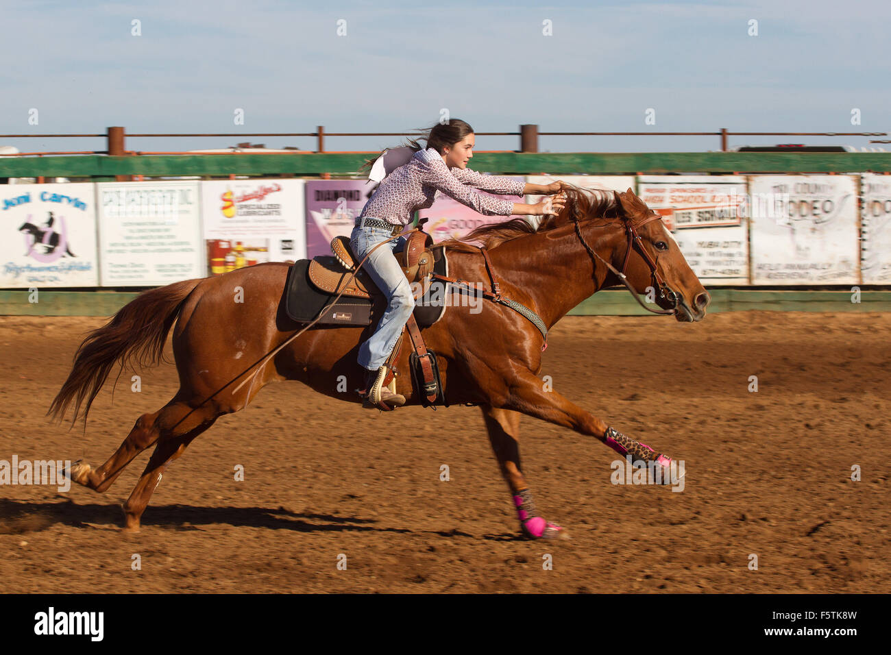 Young women compete in barrel racing at the Lincoln, California Rodeo