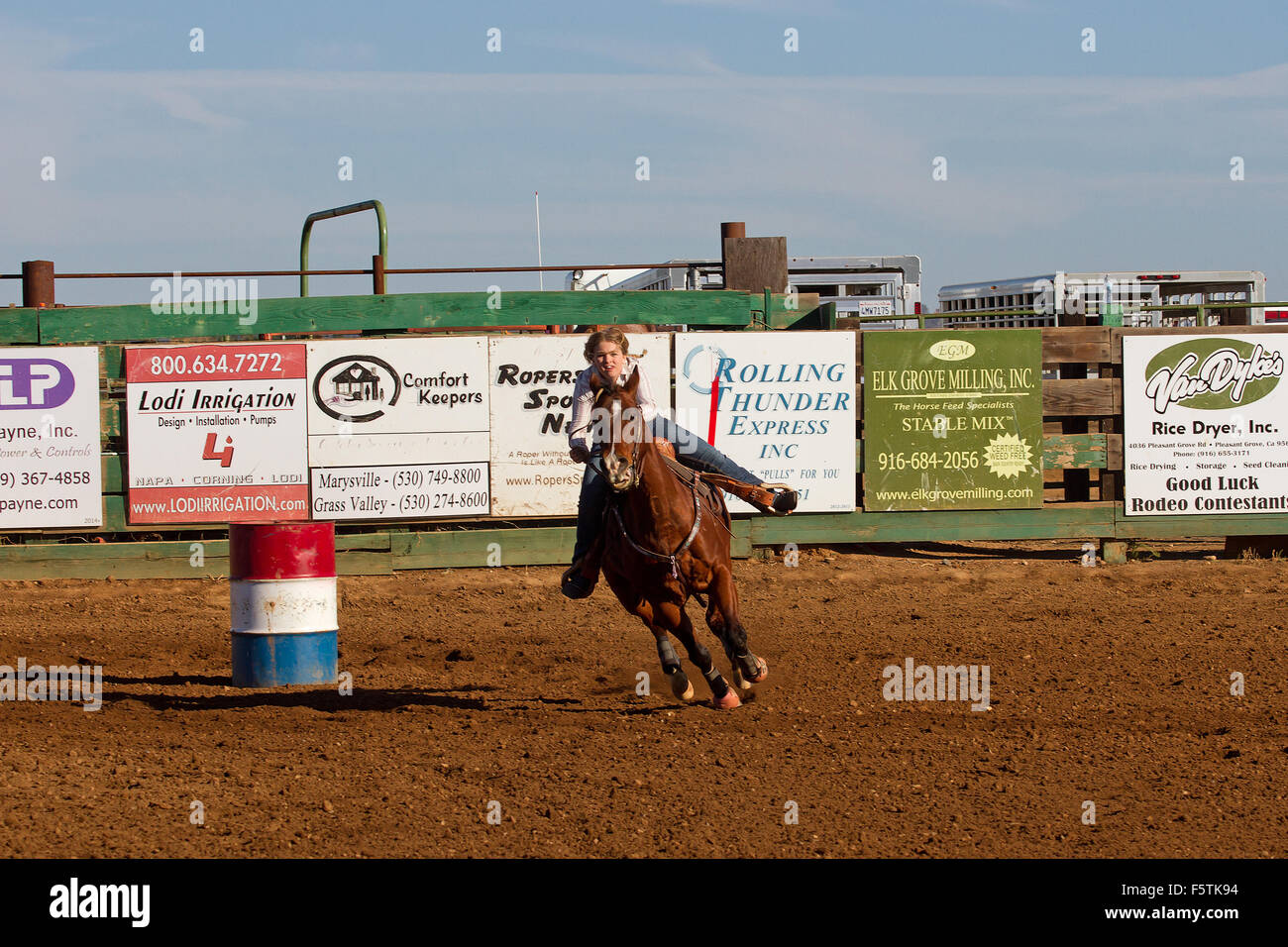 Young women compete in barrel racing at the Lincoln, California Rodeo