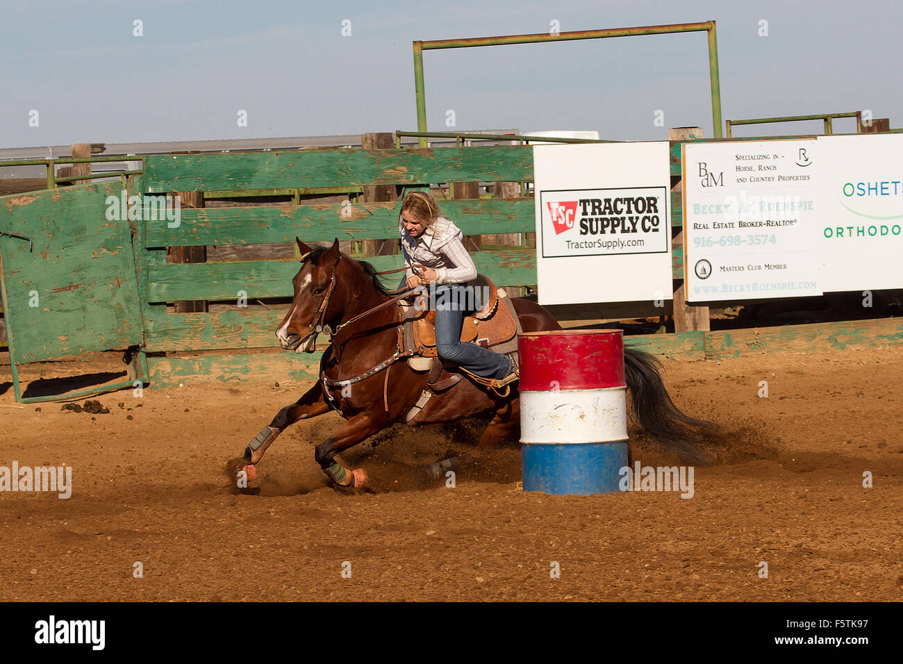 Young women compete in barrel racing at the Lincoln, California Rodeo