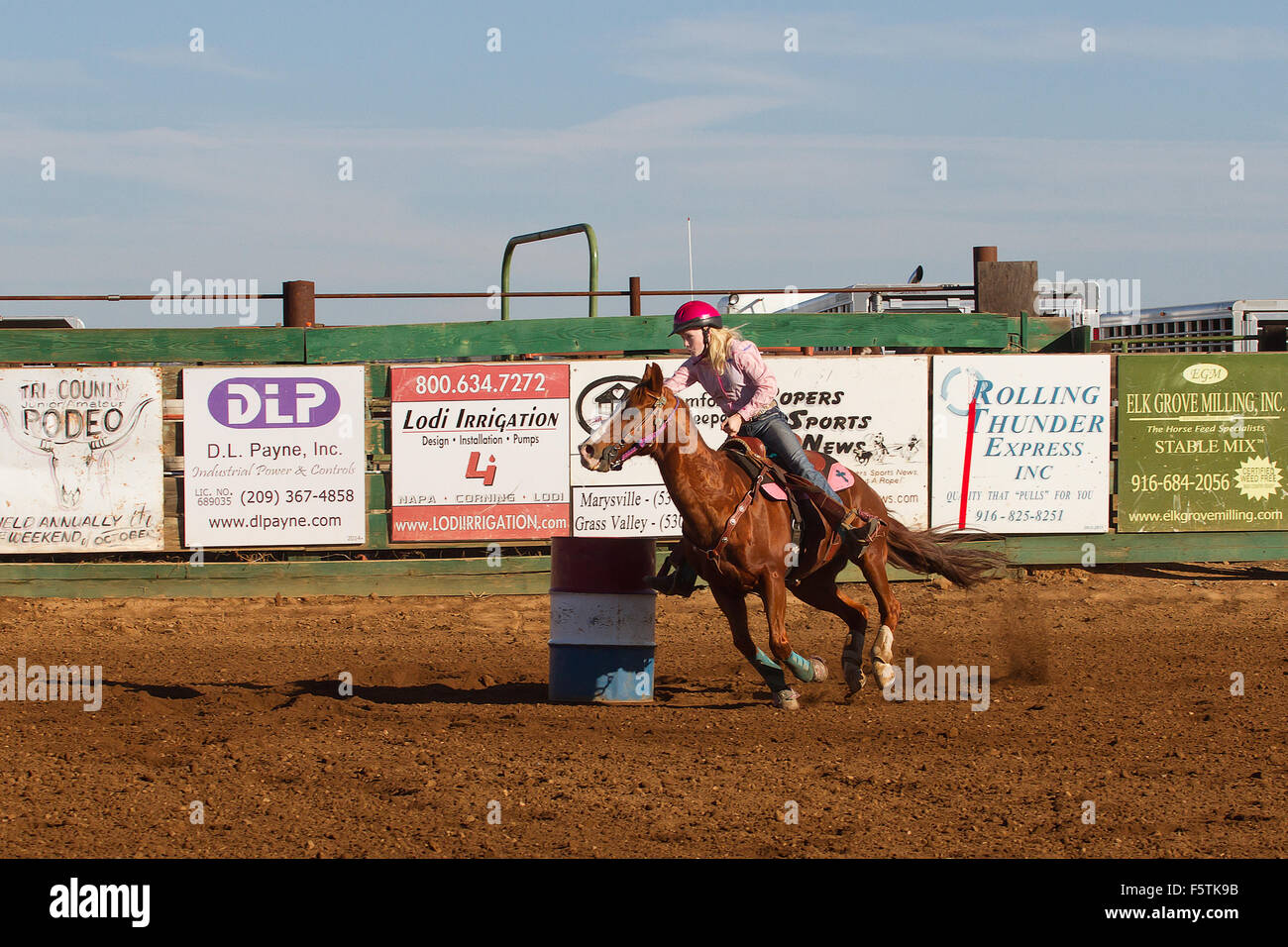 Young women compete in barrel racing at the Lincoln, California Rodeo