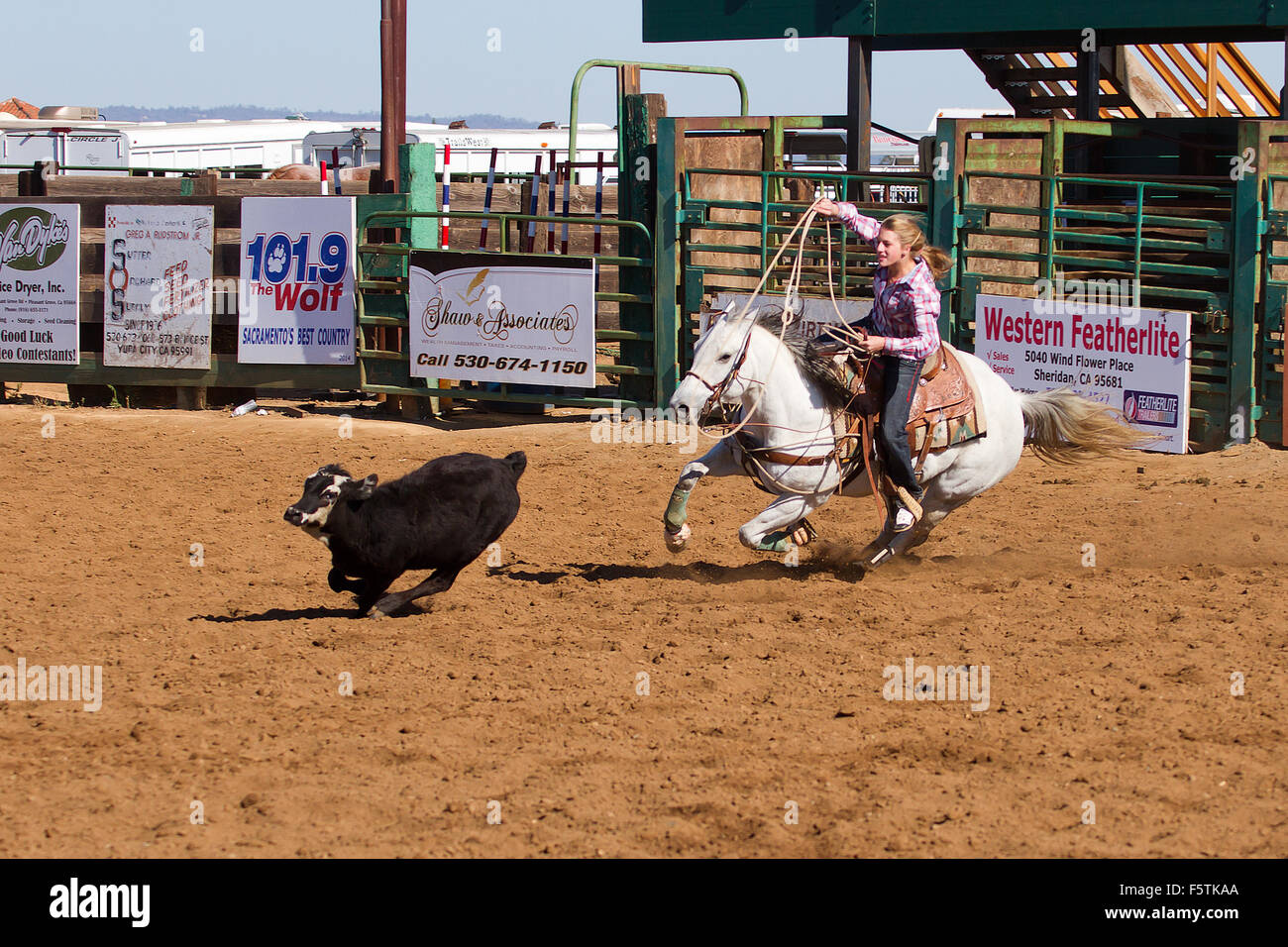 Young women compete in barrel racing at the Lincoln, California Rodeo