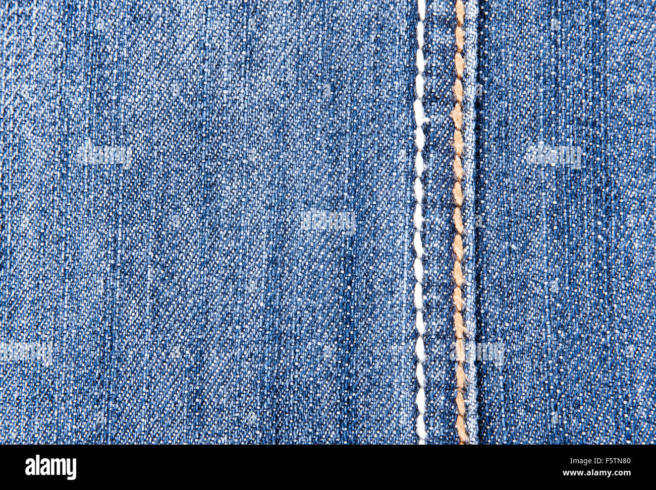 Close-up of blue jeans background with seam Stock Photo