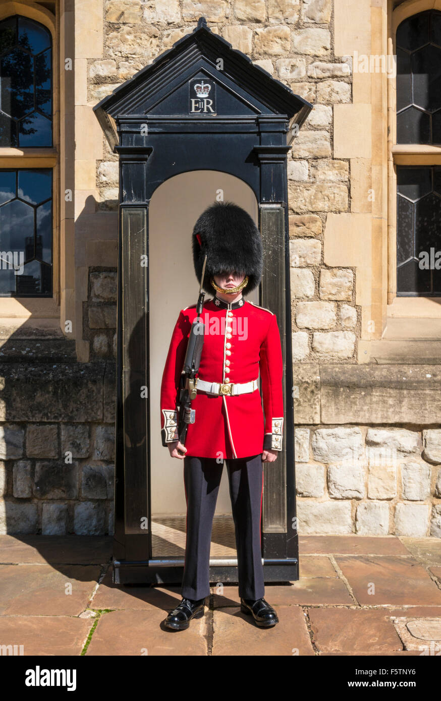 A coldstream guard guarding the Crown jewels in the Jewel house inside tower of london City of London England UK GB EU Europe Stock Photo