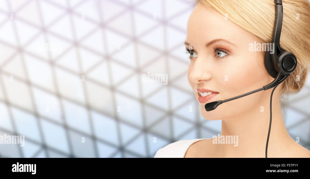 helpline operator in headset over grid background Stock Photo