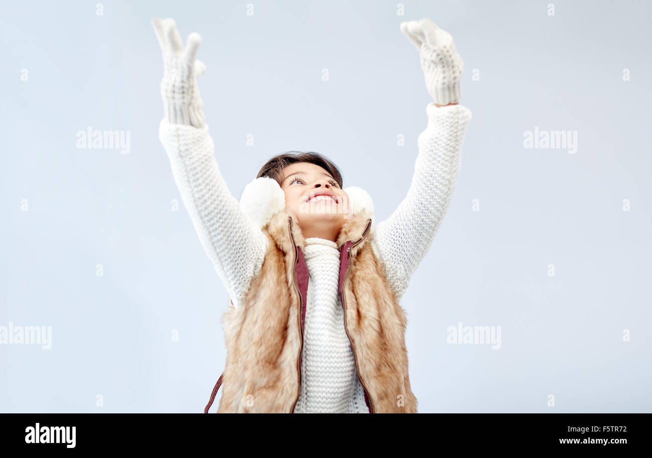 happy little girl wearing earmuffs Stock Photo Alamy