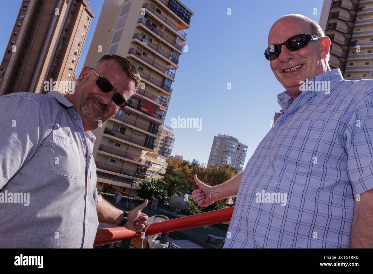 Benidorm, Spain. 9th November, 2015. Darren Duncan from Benidorms Cool FM  radio Station and Barry Pitelen from Benidorm Tourism installing a new  webcam on the prow of the 'ship' at the Marina