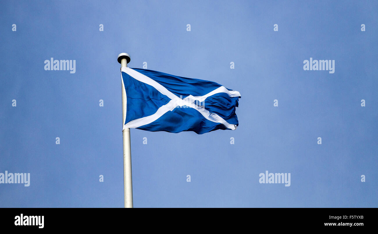 St Andrews Scottish National flag flying high above the skies over Dundee, UK Stock Photo