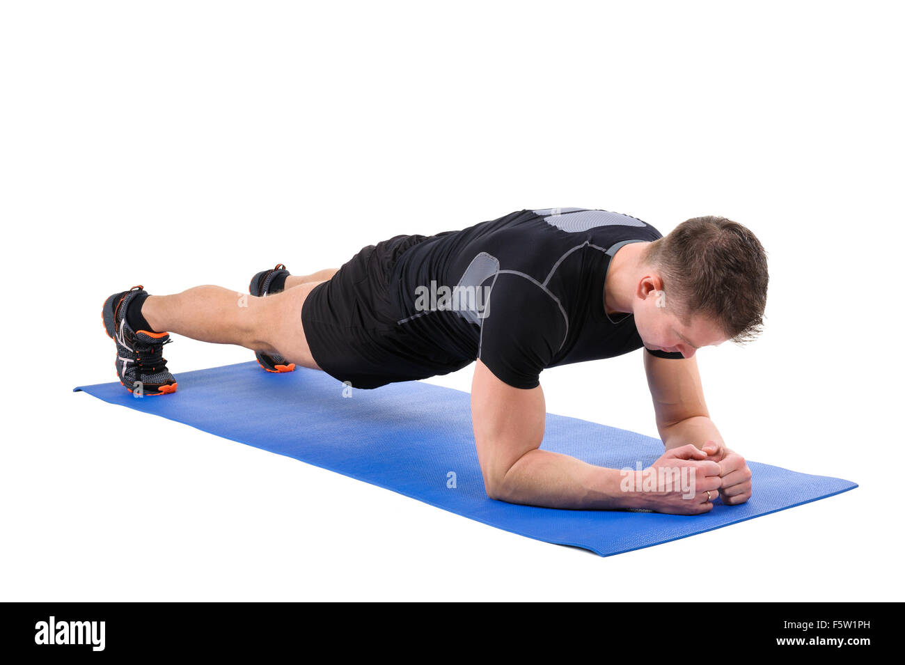 Young man doing Elbow Plank Workout Stock Photo