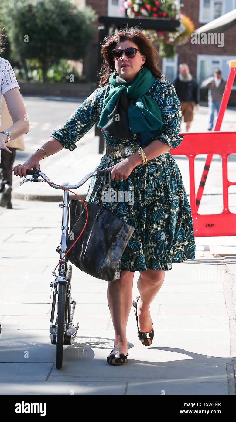 Kirstie Allsopp out in Notting Hill pushing along an adult scooter