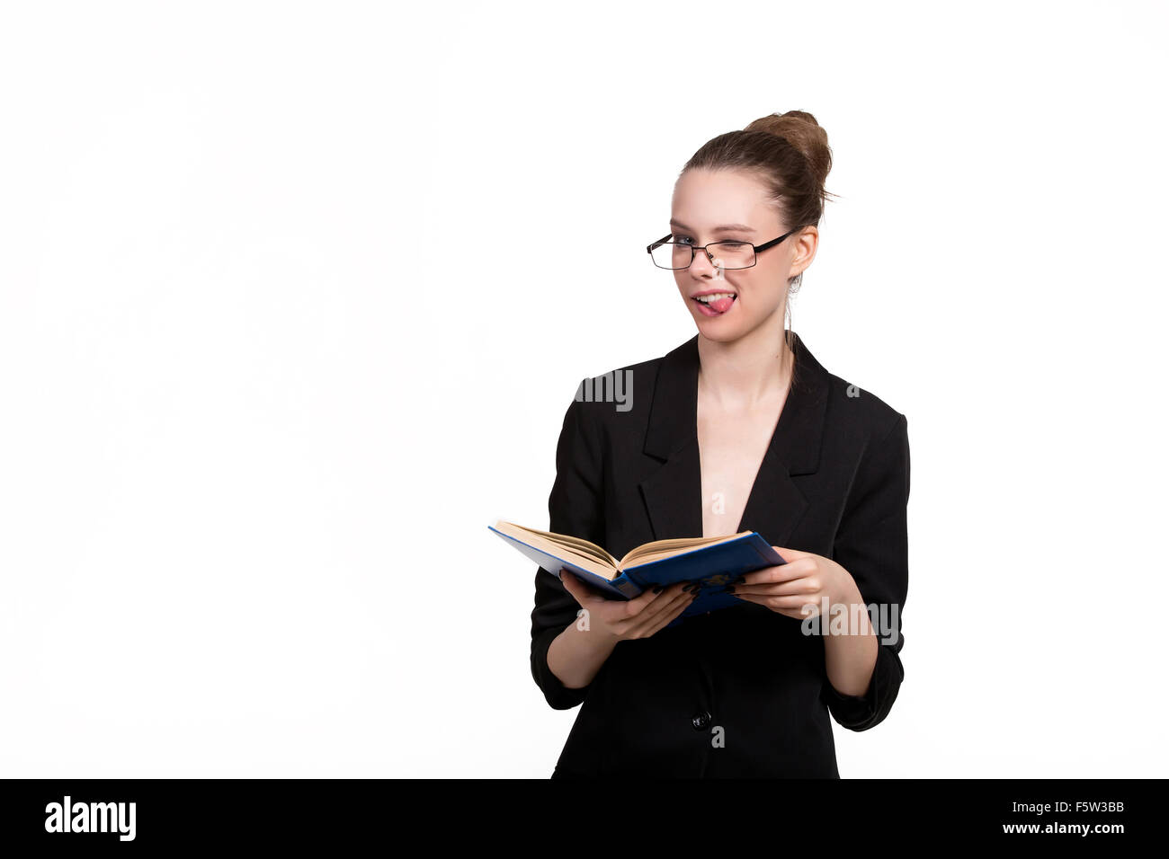 Beautiful female student holding a book and smiling on a white ...