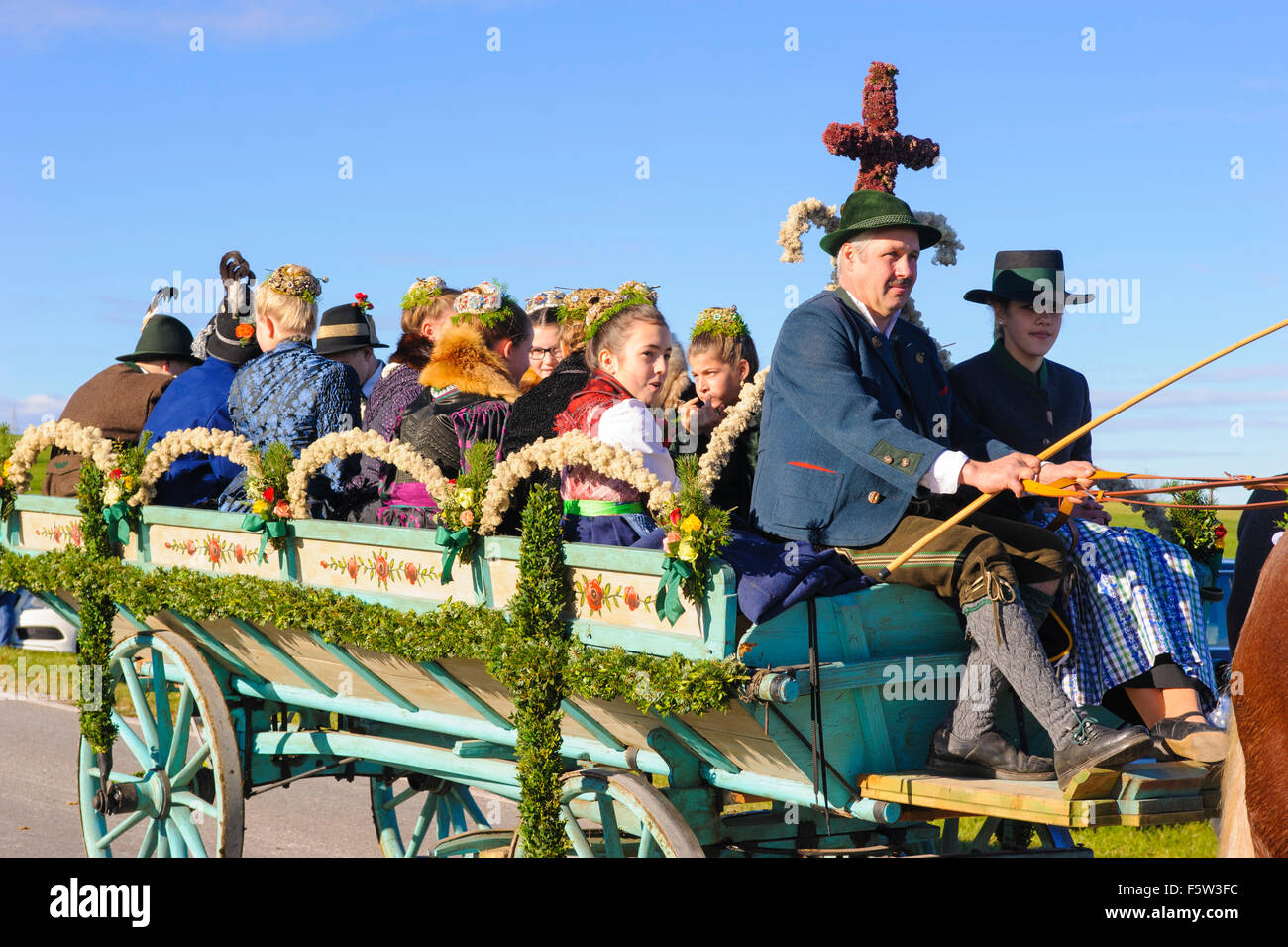 Every year a catholic Leonhardi-procession takes place in city Murnau, Bavaria, Germany, with many decorated horses an carriages Stock Photo