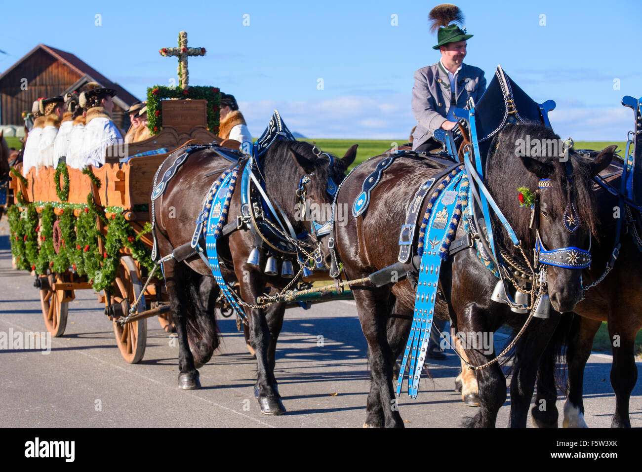 Every year a catholic Leonhardi-procession takes place in city Murnau, Bavaria, Germany, with many decorated horses an carriages Stock Photo