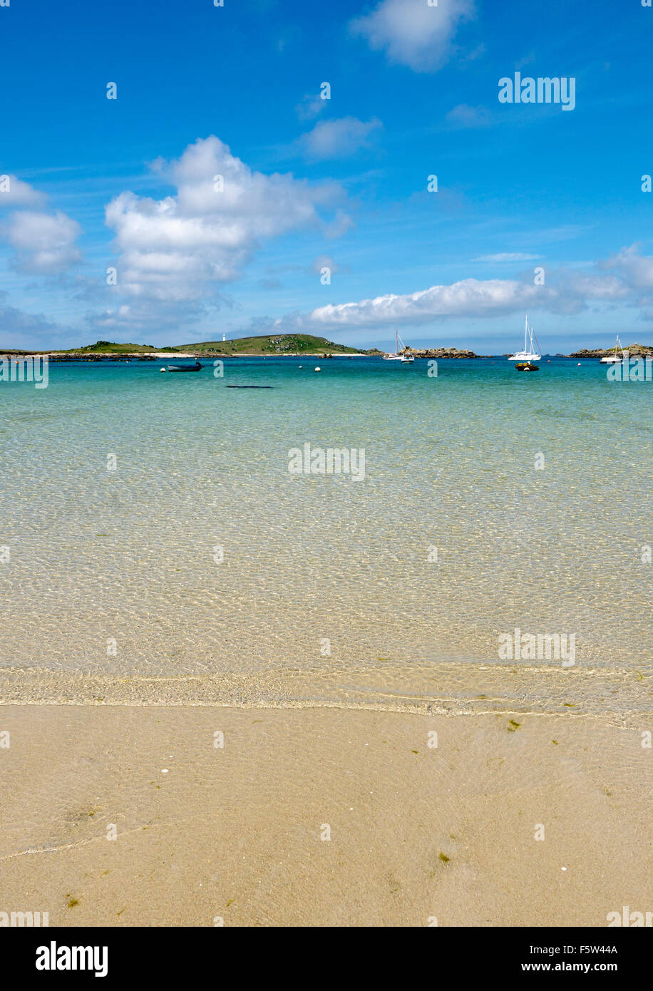Green porth beach shore clear water, Tresco, Isles of Scilly Cornwall England. Stock Photo