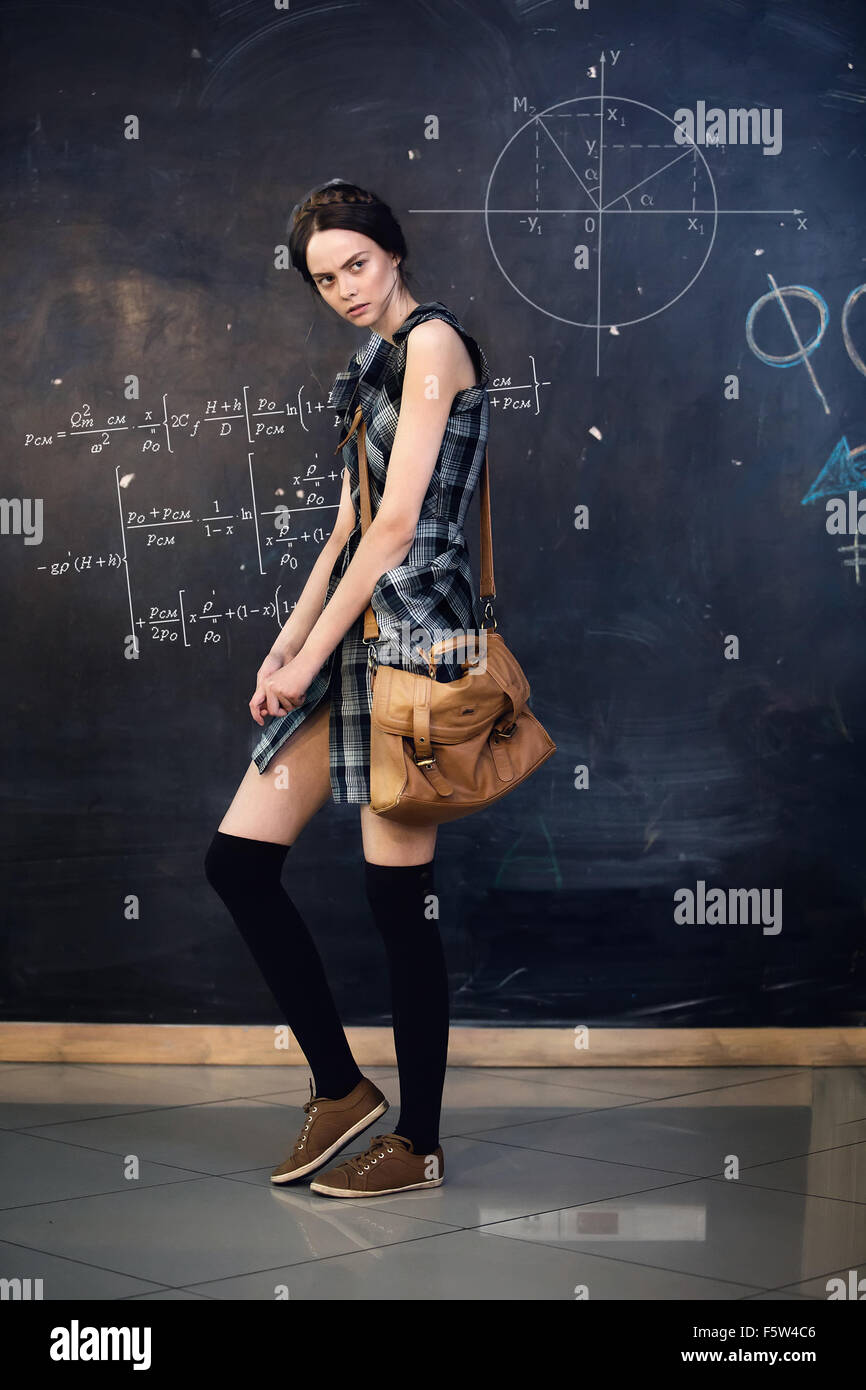 beautiful tsudentka solves the problem at the blackboard at university Stock Photo