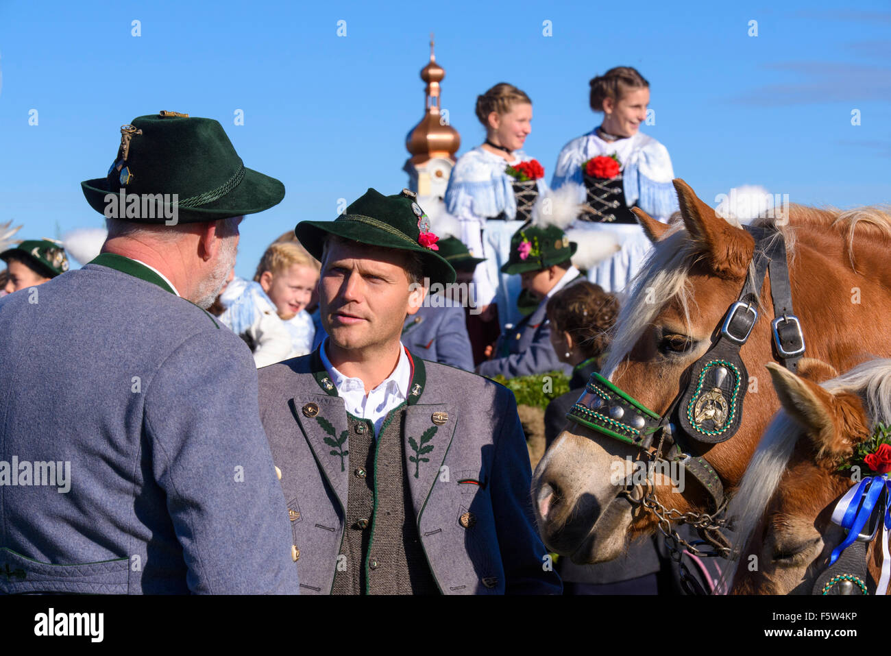 Every year a catholic Leonhardi-procession takes place in city Murnau, Bavaria, Germany, with many decorated horses an carriages Stock Photo