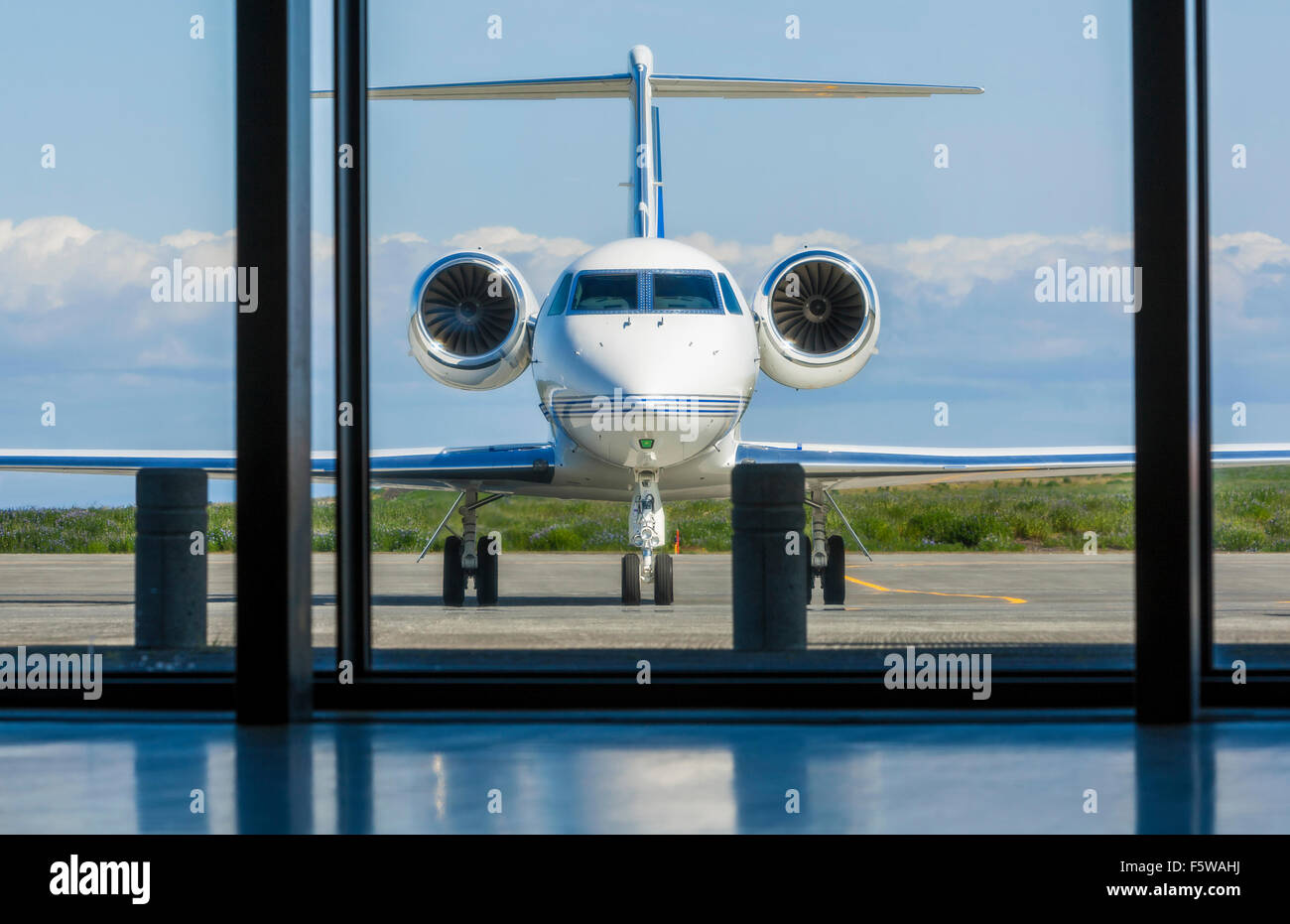 Private corporate jet airplane or aeroplane parked at an airport Stock Photo