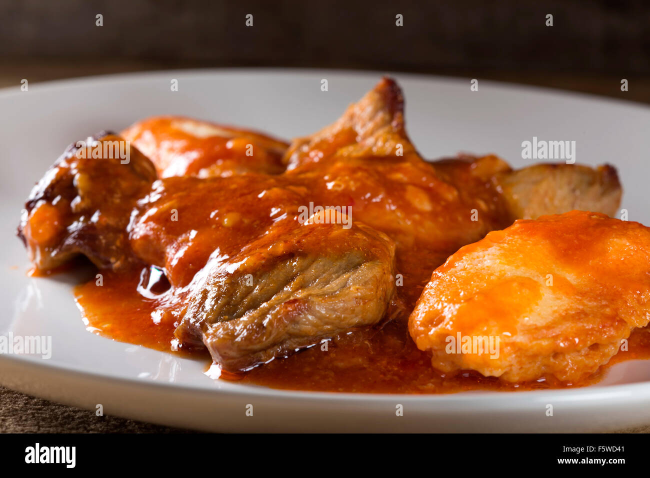 Plate with stew of pork meat (goulash) and dumplings Stock Photo