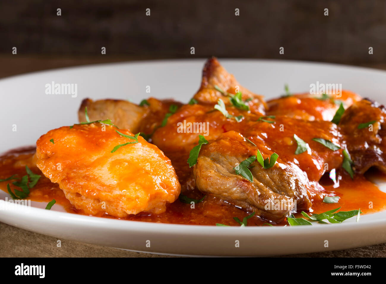 Plate with stew of pork meat (goulash) and dumplings Stock Photo Alamy