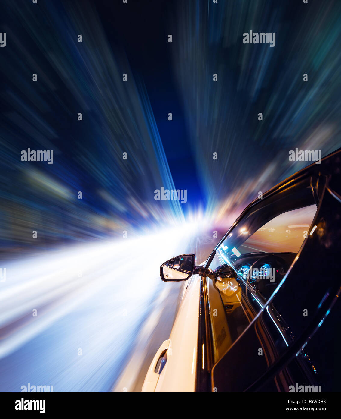 Car driving at night city with blur motion Stock Photo