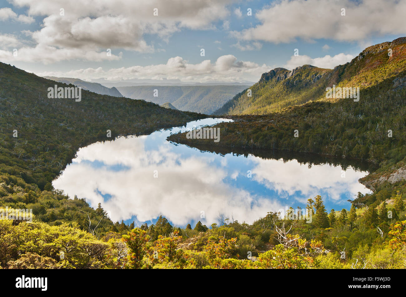 Lake Hanson cloud reflections in world heritage-listed Cradle Mountain National Park.. Stock Photo