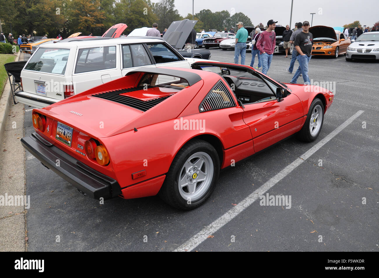 A Red Ferrari sports car at a car show. Stock Photo