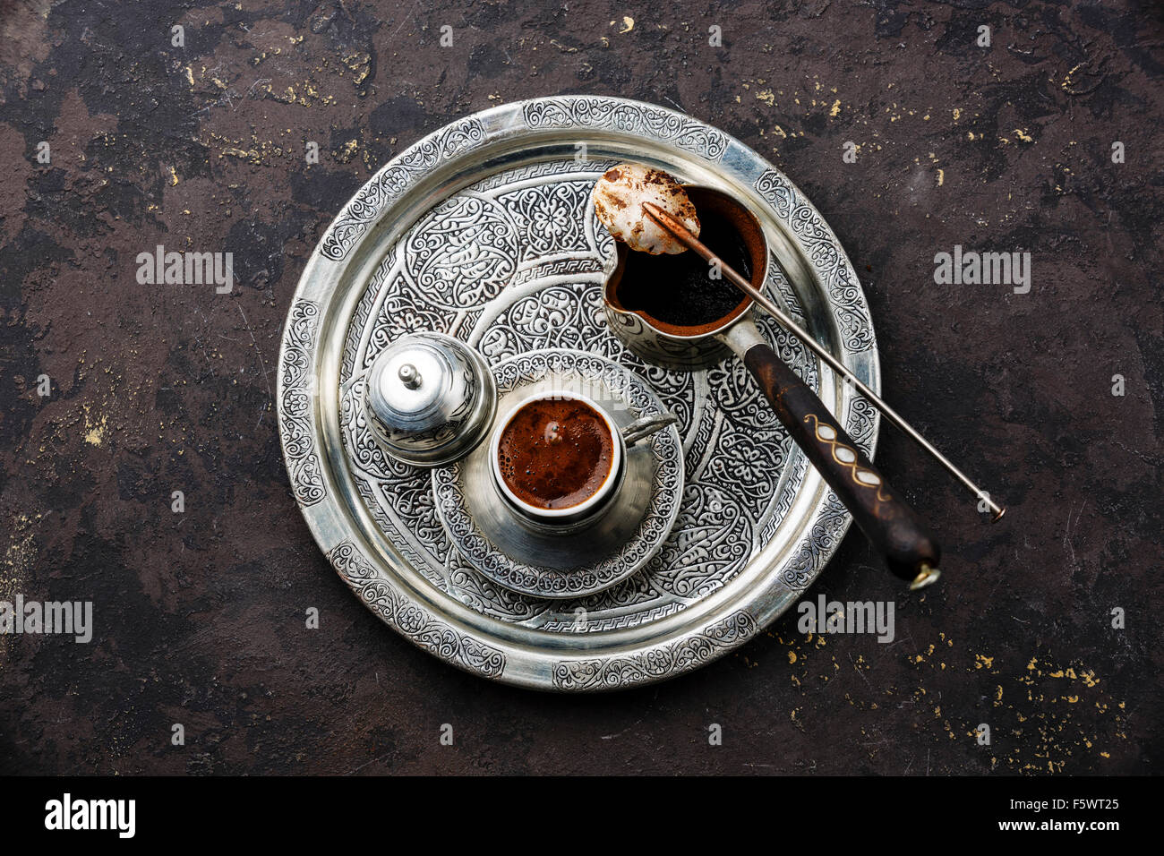 Turkish coffee in coffee pot on black stone background Stock Photo