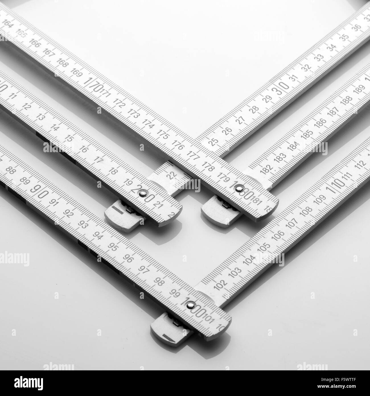 Closeup of white wooden rulers Stock Photo - Alamy