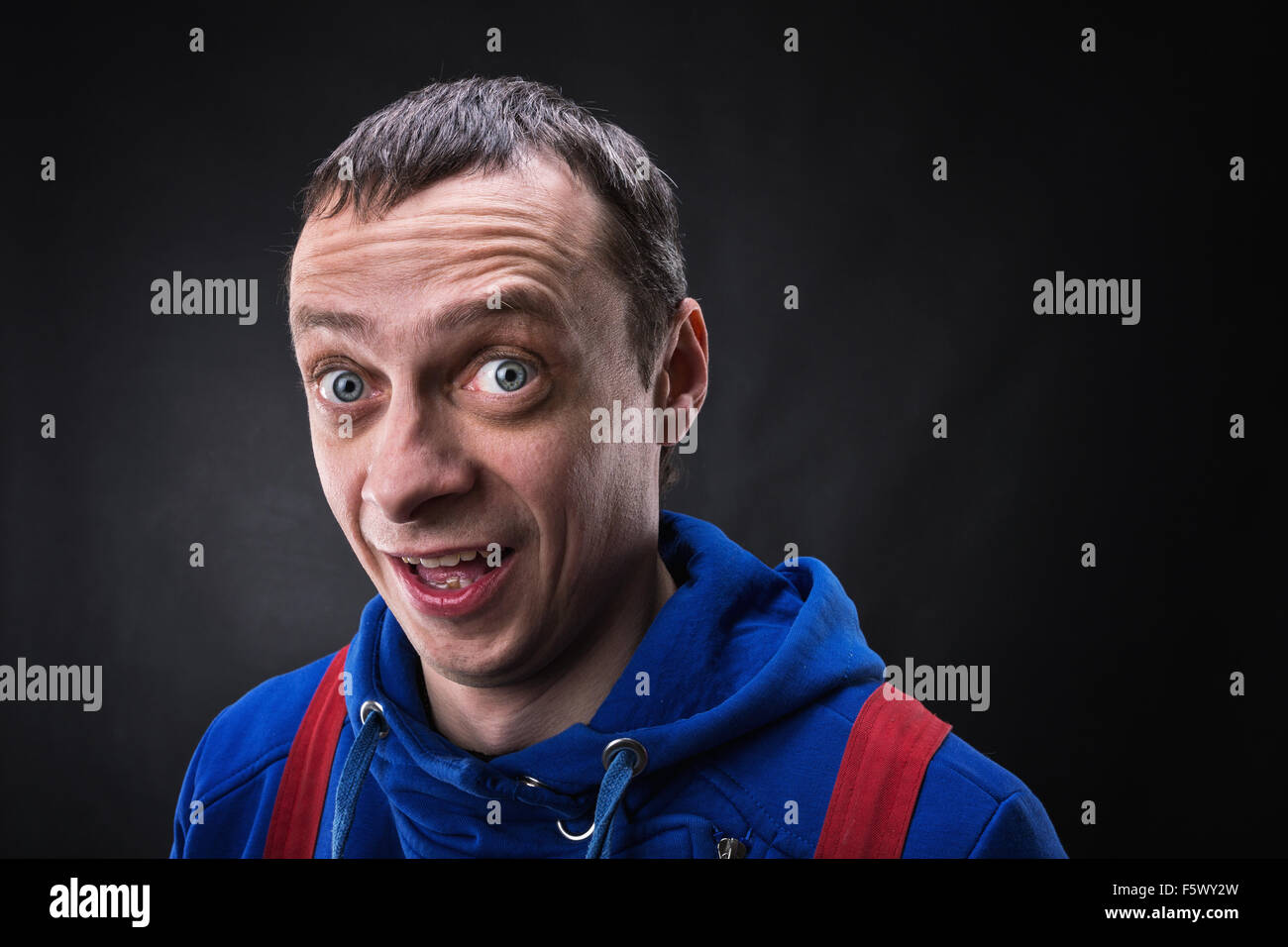 Surprised young man with big eyes and open mouth Stock Photo Alamy