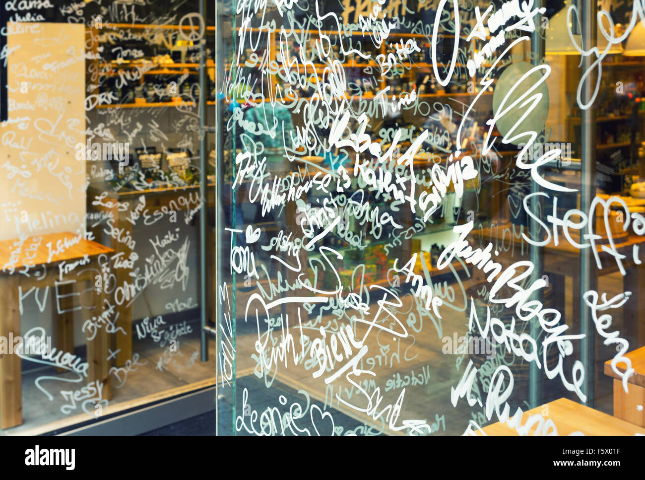 Names on store showcase glass Stock Photo Alamy