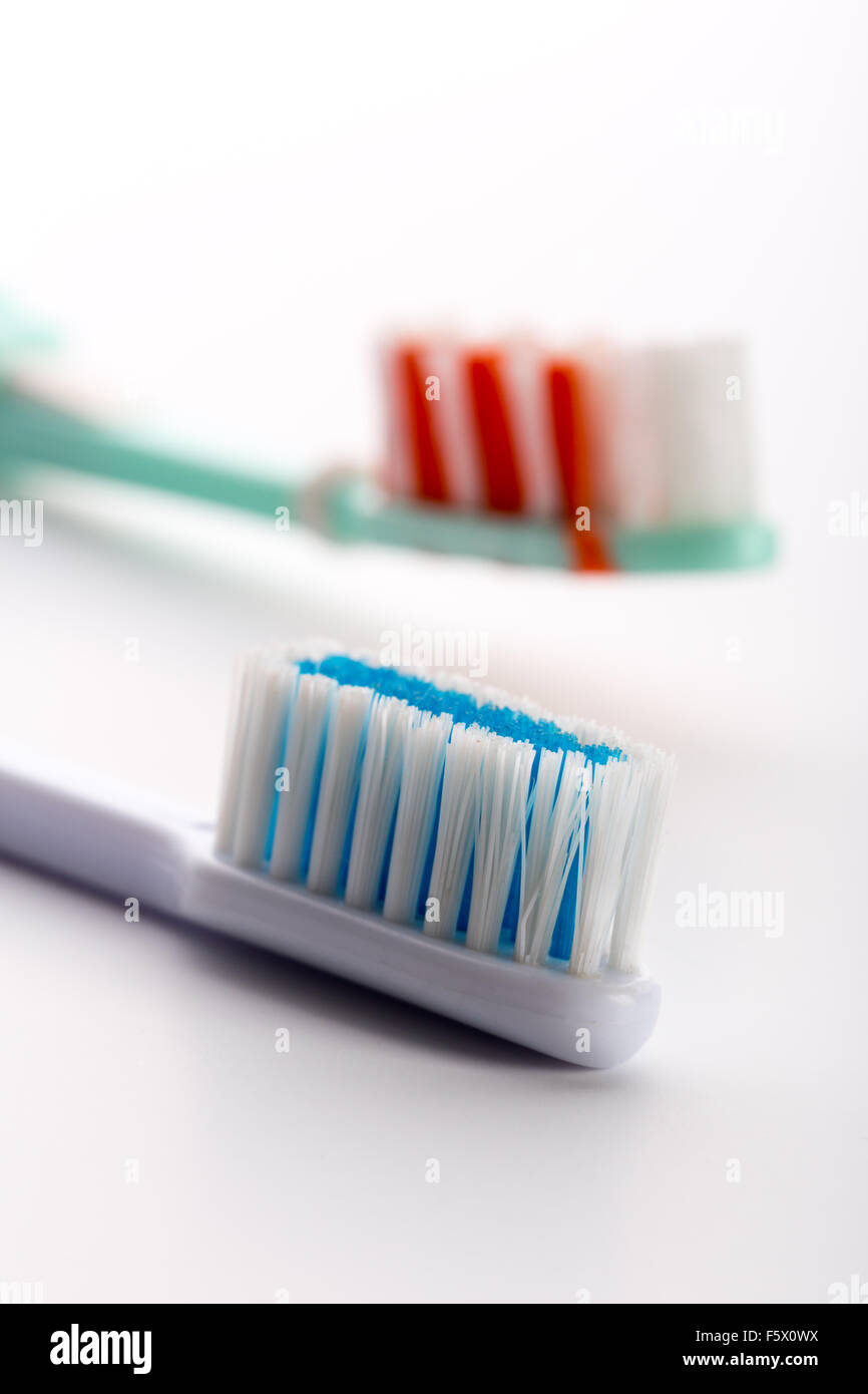 A closeup of two toothbrushes isolated on white background Stock Photo ...