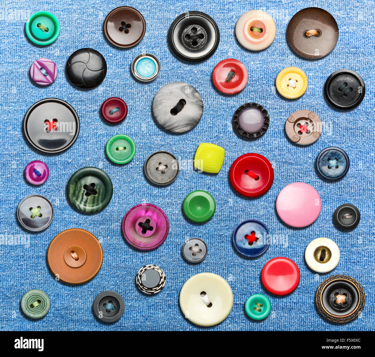 Many colorful buttons on blue background Stock Photo - Alamy