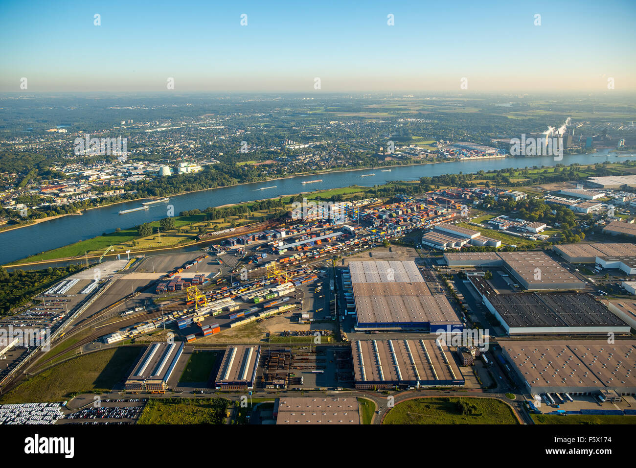 stacked containers on Logport I, inland port, Rheinhausen, Duisburg harbor, Duisburg, Ruhr area, Nordrhein-Westfalen, Germany, Stock Photo