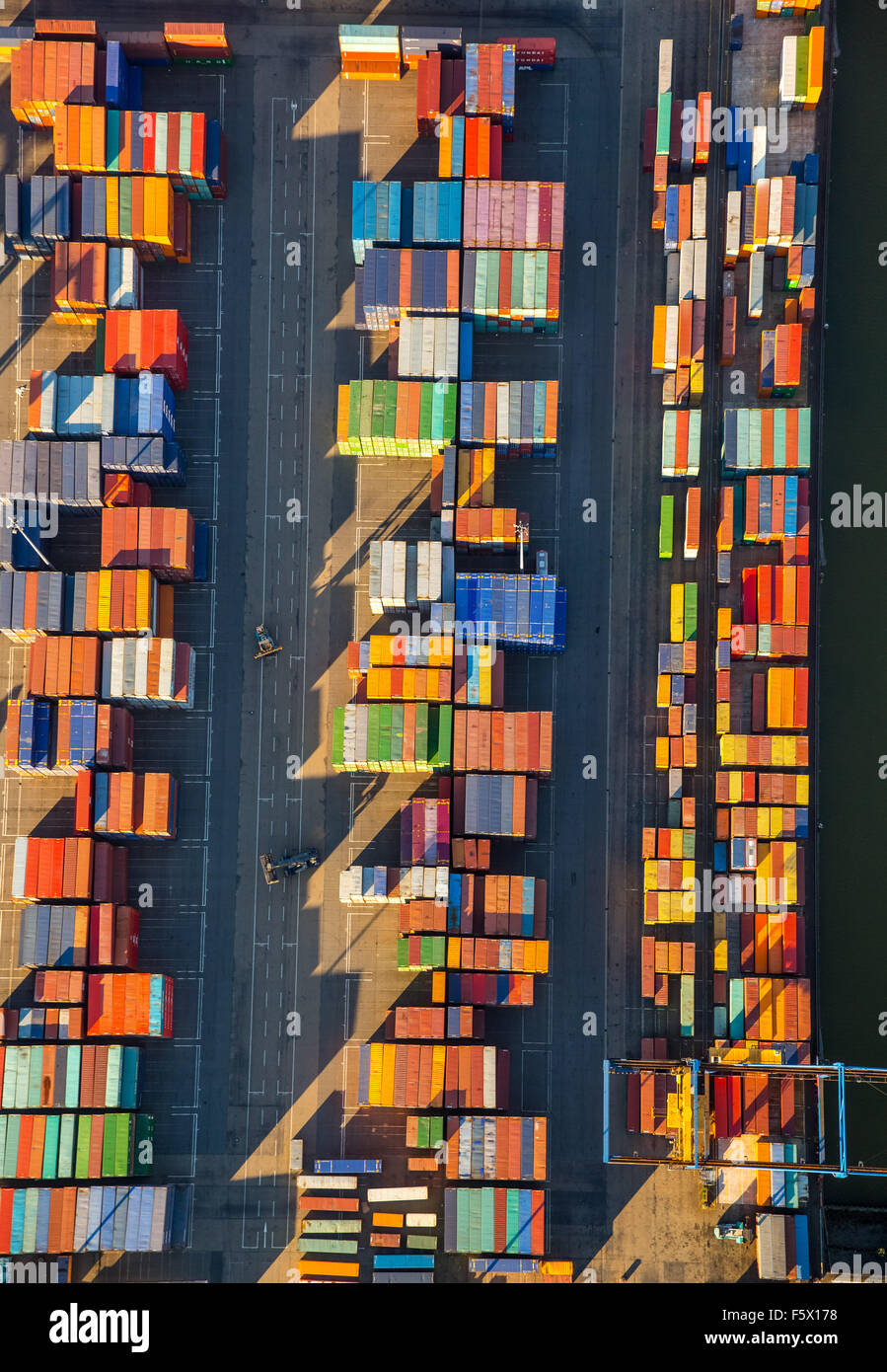 stacked containers on Logport I, inland port, Rheinhausen, Duisburg harbor, Duisburg, Ruhr area, Nordrhein-Westfalen, Germany, Stock Photo