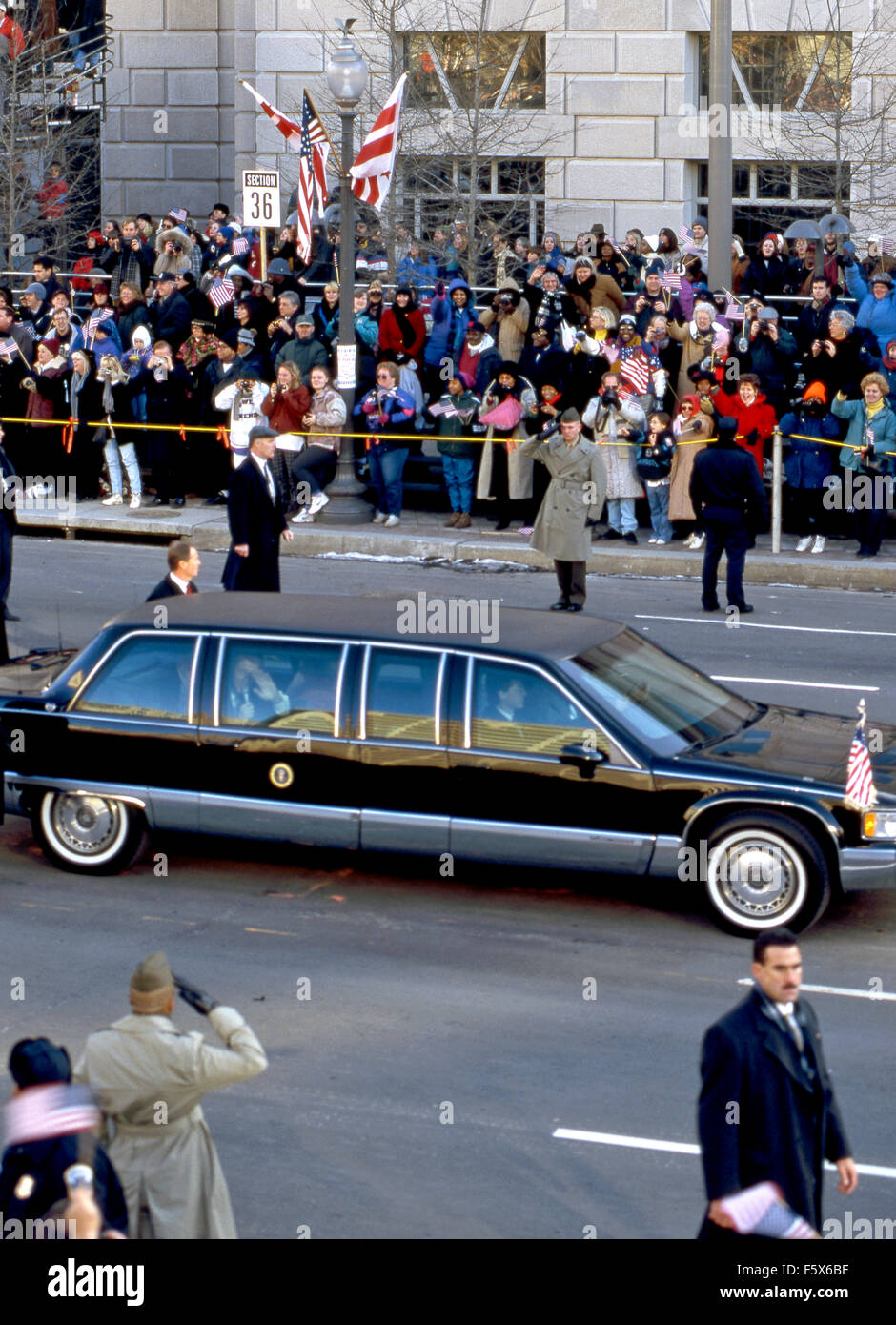 Washington, DC.USA. 20th January 1997 President William Jefferson Clinton waves from inside the 'Beast' limousine as his inaugural parade passes 14th street freedom plaza.  Credit: Mark Reinstein Stock Photo