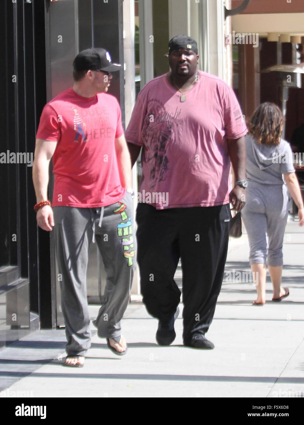 Quinton Aaron, the star of the Oscar-nominated film The Blind Side, goes  shopping in Beverly Hills in a pink t-shirt with a friend Featuring: Quinton  Aaron Where: Los Angeles, California, United States